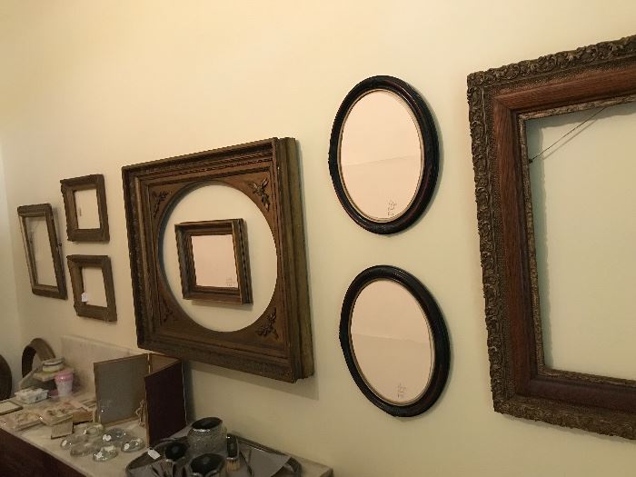 Antique picture frames, antique washstands with marble tops