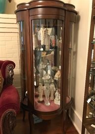 Beautiful antique small scale display cabinet featuring curved front with matching curved glass shelves 