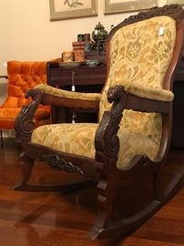 Victorian rocking chair featuring hand carved arms in the shape of a Griffin 