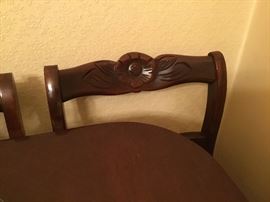 Closeup of chairs to dining table