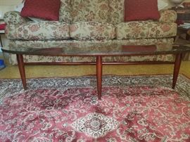 Sofa, rug, and great surfboard coffee table