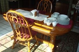 Oak double pedestal dining table and six Windsor style chairs.