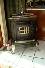 Antique cast iron stove with cook top. Burns coal or wood, completely restored!