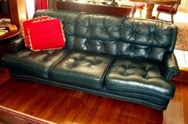 Green leather sofa.