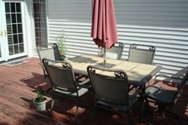 Great patio set with inlaid granite tile top table.