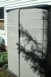 Garage cabinet full of yard tools.