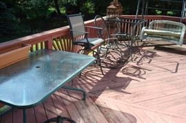 Other patio items including six swivel high seat chairs.