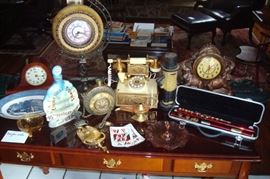 Antique electric elephant clock, Piccolo flute and other collectibles.