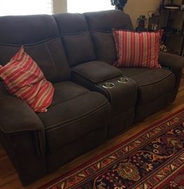 Sofa is almost BRAND NEW!! Cup holders would make this great for a man cave or den!