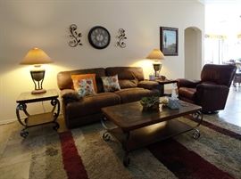 SOFA IS ELECTRIC POWERED RECLINER AND LOOKS SHOWROOM NEW!!! Lazyboy chair, rug, tables, lamps, pillows, wall art all in beautiful condition. The furnishings look new.