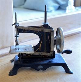 Antique sewing machine made in Germany over 75 years old. The owner's mother actually sewed with this. It really sews!
