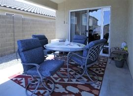 Outdoor dining set. Glass table top and chairs.