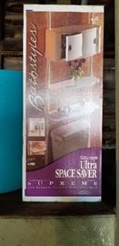 26. Ultra Space Saver bathroom shelf, new in box