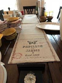 Large, beautiful farm style dining table with chairs.