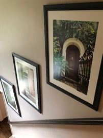 Oversized photographs depicting doors and ivy scenes.