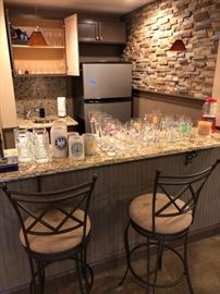 Bar stools, glasses and other bar items.