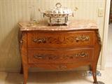 Bombay chest with travertine marble top and silver chafing dish (living room).