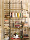 Baker's rack in kitchen with cookbooks.