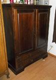 Cherry finish armoire for large TV.