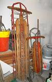 Vintage Happi-Time and Silver Streak snow sleds.