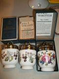 Royal Worcester egg coddlers Lavinia pattern (left, center) and Bournemouth pattern (right).