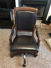 Executive Seating Executive Swivel Tilt Chair, beautiful wood carved arms, base and frame in a rich Old World espresso wood finish with finished leather.