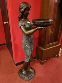 Magnificent 4 Foot Tall Bronze Sculpture | Beautifully Patinated | Never used and in Fine Condition | Depicts barefoot girl in dress holding a bowl |  The Bronze Statue is Plumbed for Optional Use as a Fountain | Dimensions: 4′ ft. H.

