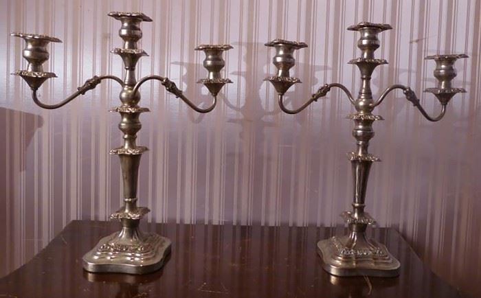 A magnificent, fine and impressive pair of Antique Victorian English Sterling Silver Three-Light Candelabras | Circa. 1840 | The Candelabra are Hallmarked with a London Assay Office Letter for Circa. 1840 | Each have Three (3) Branch Candelabra holding 3 candles with twisted arms and wax drip guards | The dimensions 19″ H x 16″ W; Each Candelabrum Base is 6″ x 6″ | Weight: Approx. weight 6 lbs. + 6.5oz. and 6 lbs. + 6.3 oz..