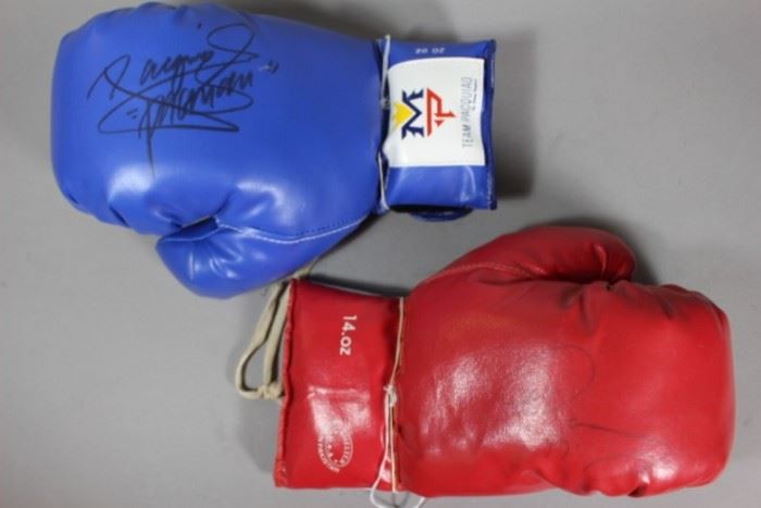 A Manny Pacquiao autographed blue Team Pacquiao boxing glove (20 oz) | Pac Man signed the back of the glove with a black marker. His signature is bold and clear with no smudging | Measures 12″ x 7″ |