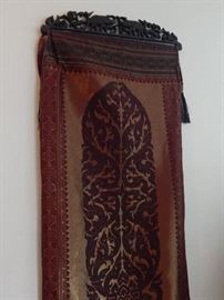 Wall art ... Fabric with carved wooden hanger. Lots of detail to hanger.