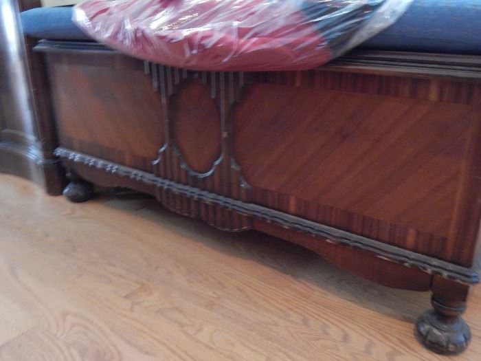 This is a footed bed chest. Inlaid wood and rather unusual. Check it out for that one of a kind piece!
