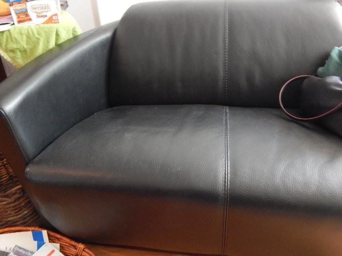 One of two contemporary leather love seats in excellent condition! Black!