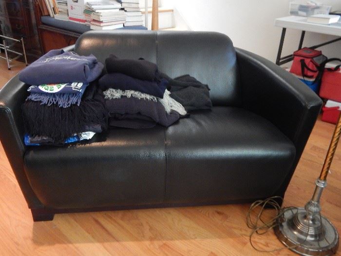 One of two love seats. Black leather in excellent condition.