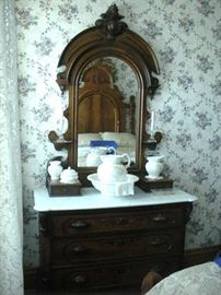 Multiple pieces of Antique Victorian Marble Top Furniture Pieces....Dressers, Washstand, Pier Mirror and Tables.