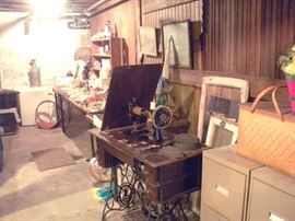 Basement seems to go on forever.  1 of 2 Singer Treadle Sewing Machines. 