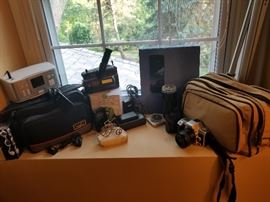 Nice selection of camera equipment including Minolta, Nikon, HP,  Vivitar, Hoya