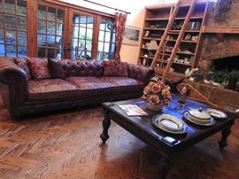 One of two Imported Italian Style Leather Sofas. Available prior to actual sale day.