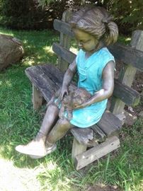Sitting Savannah girl with dog cast bronze sculpture