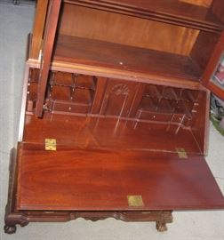 Chippendale, desk opened, revealing pigeon holes, drawers, and hinged door