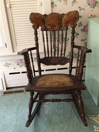 Antique rocking chair. Original upholstery. 