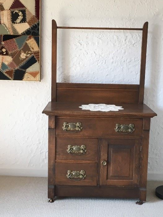 Antique wash stand with hanging rack.