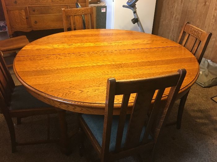 Antique Solid Oak table with four chairs.