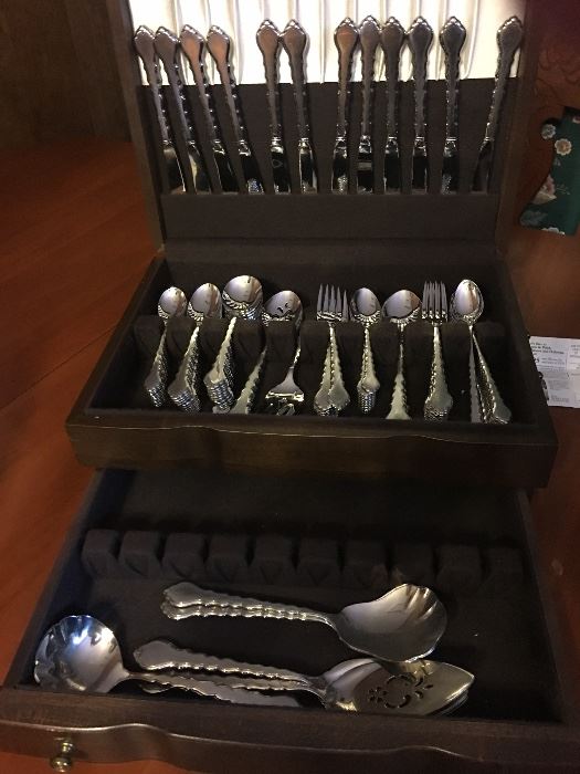 Chatelain stainless steel service for 12 with serving pieces. Never been used. In beautiful mahogany chest.  New it was $460. 
