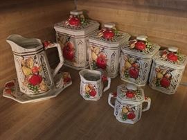 Canister set, pitcher, sugar & creamer. Also has matching salt & pepper shaker.  $30