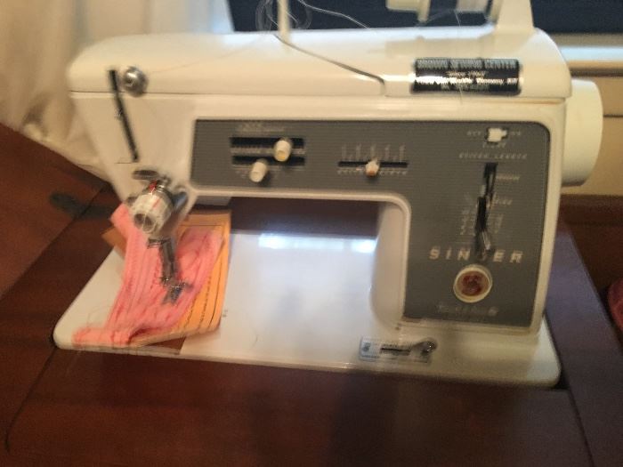 Singer sewing machine. comes in desk with matching chair