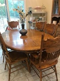 Oak Table and 6 chairs.  Small matching china cabinet is there as well