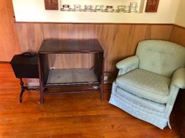 TV cabinet and upholstered armchair