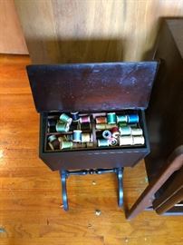 Antique sewing box filled with notions