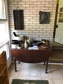 Antique drop leaf table, and large selection of crocks
