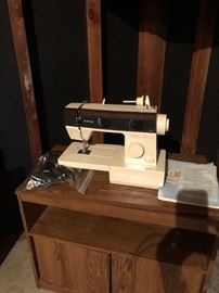 Sewing machine and cabinet